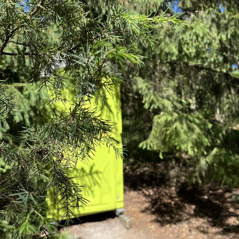 Green mobile toilet.
